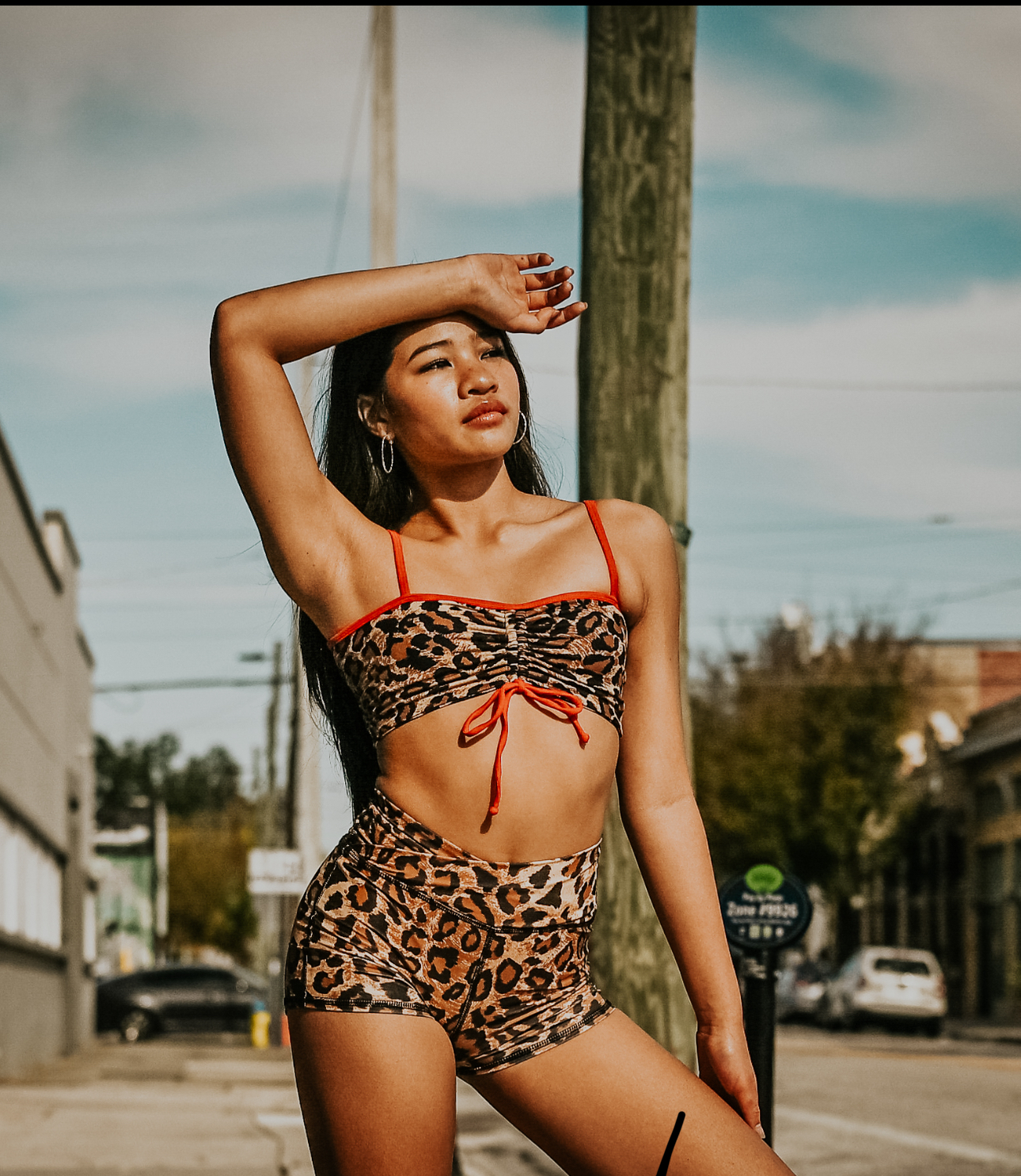 Close portrait of Richani in leopard print dancewear on a city street